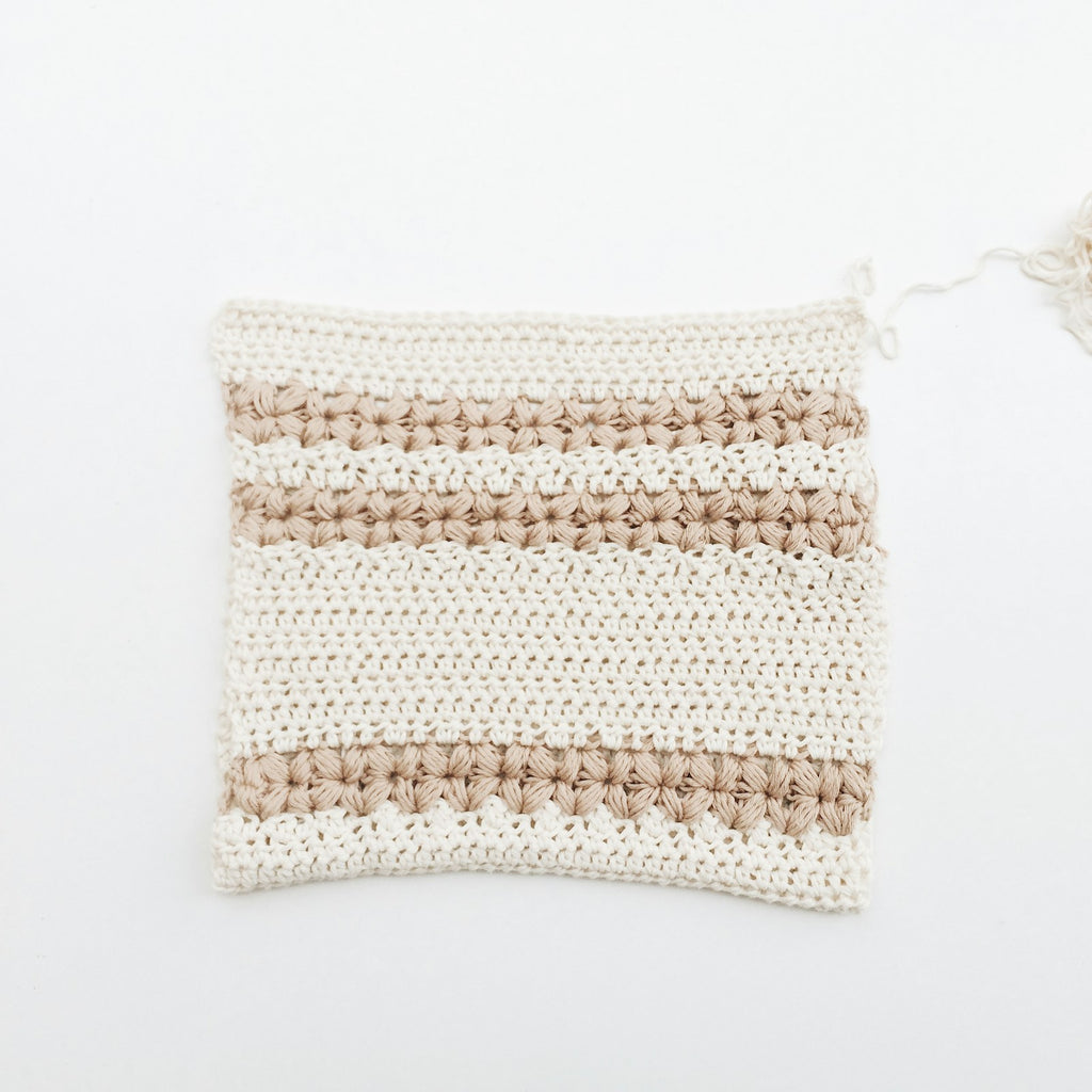 Crocheted cotton tawashi sponge on a white background