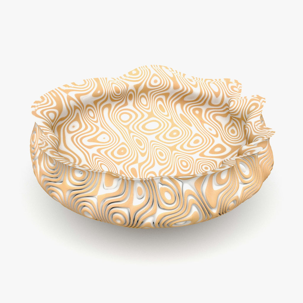 Fabric cover stretched over a bowl on a white studio background