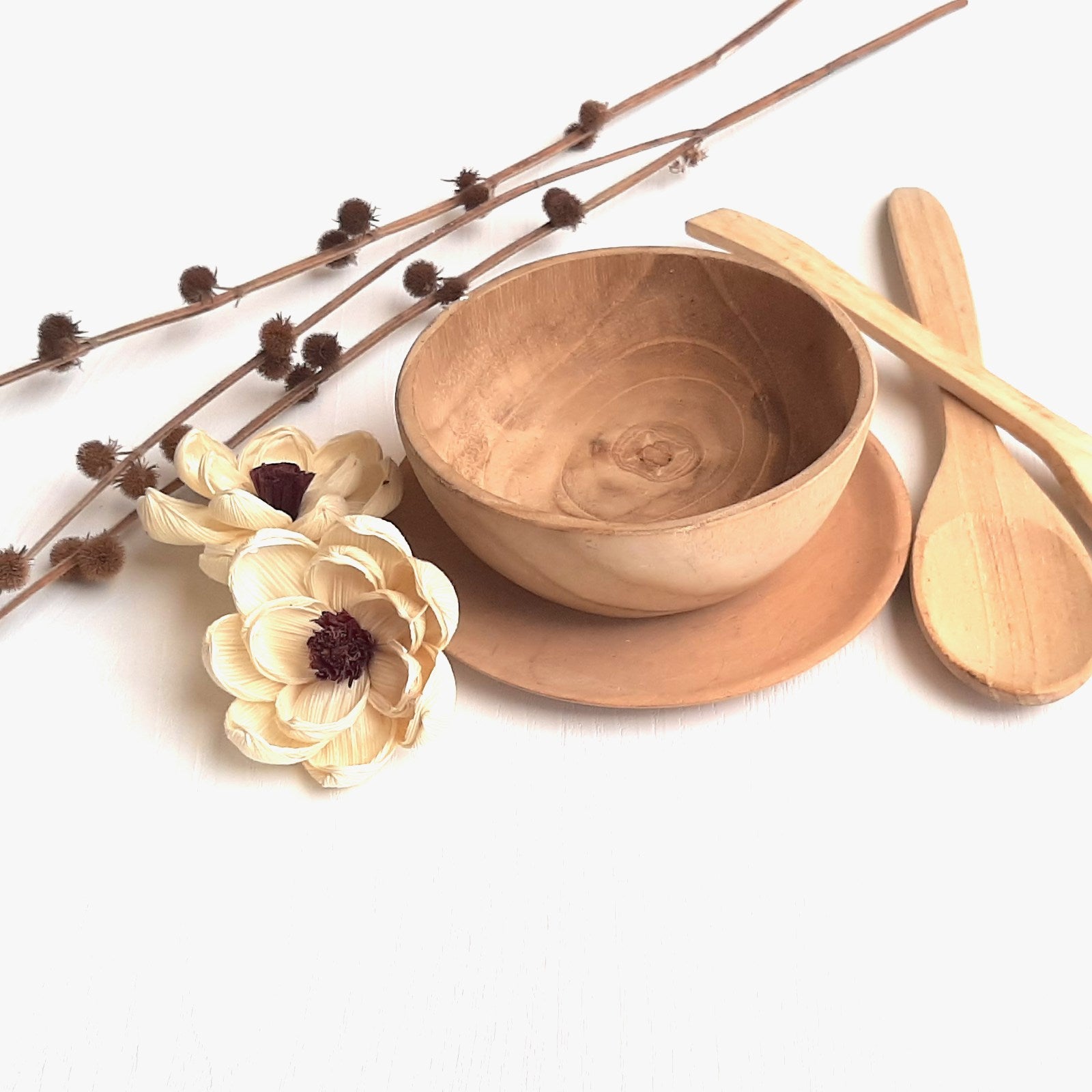 Wooden kitchen utensils - wooden bowl and spoon on white background