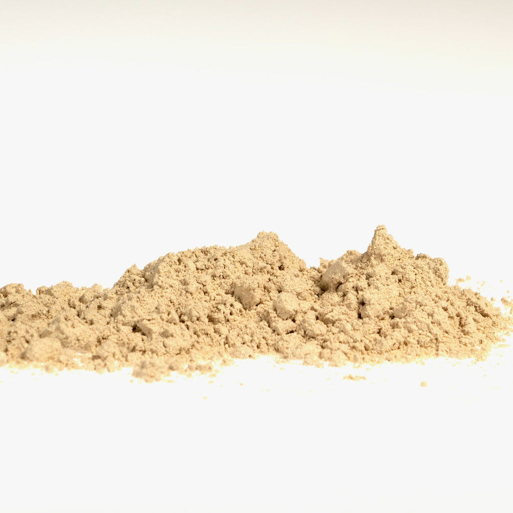Bentonite clay powder on a white studio background
