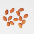 Sweet almonds on white background