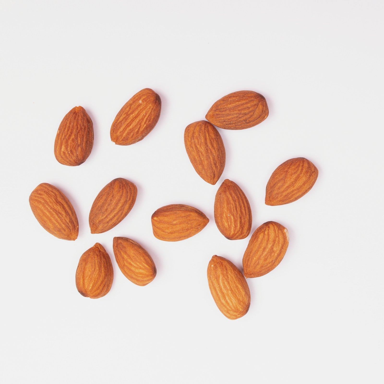 Sweet almonds on white background